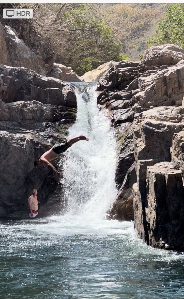 Patrick cliff diving into a waterfall pool, Puerto Vallarta, 2022