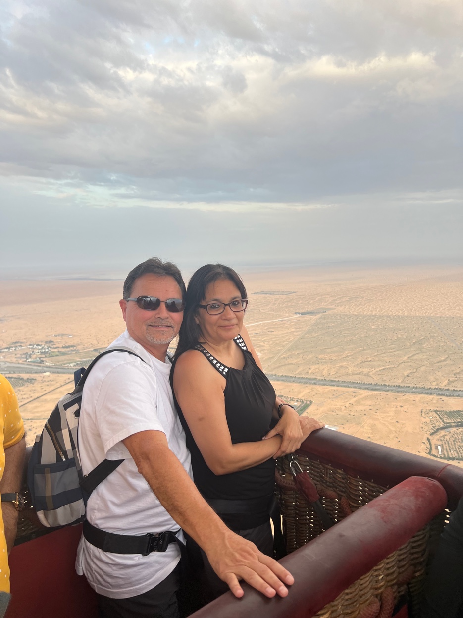 Patrick and Cyndi in a hot air balloon basket over Dubai